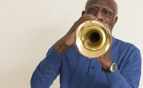 Older man playing the trumpet